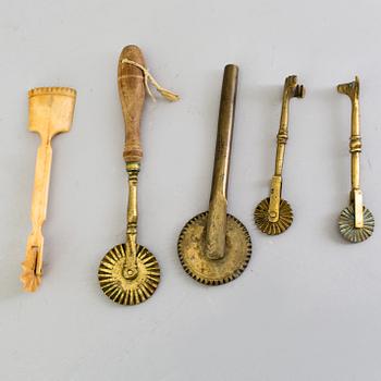 FIVE BAKING UTENSILS, bronze, bone and wood, 18th century.