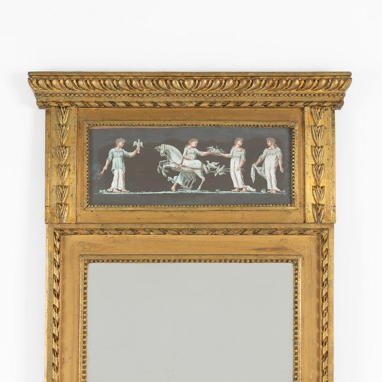 A late Gustavian giltwood and inset gouache mirror, circa 1800.