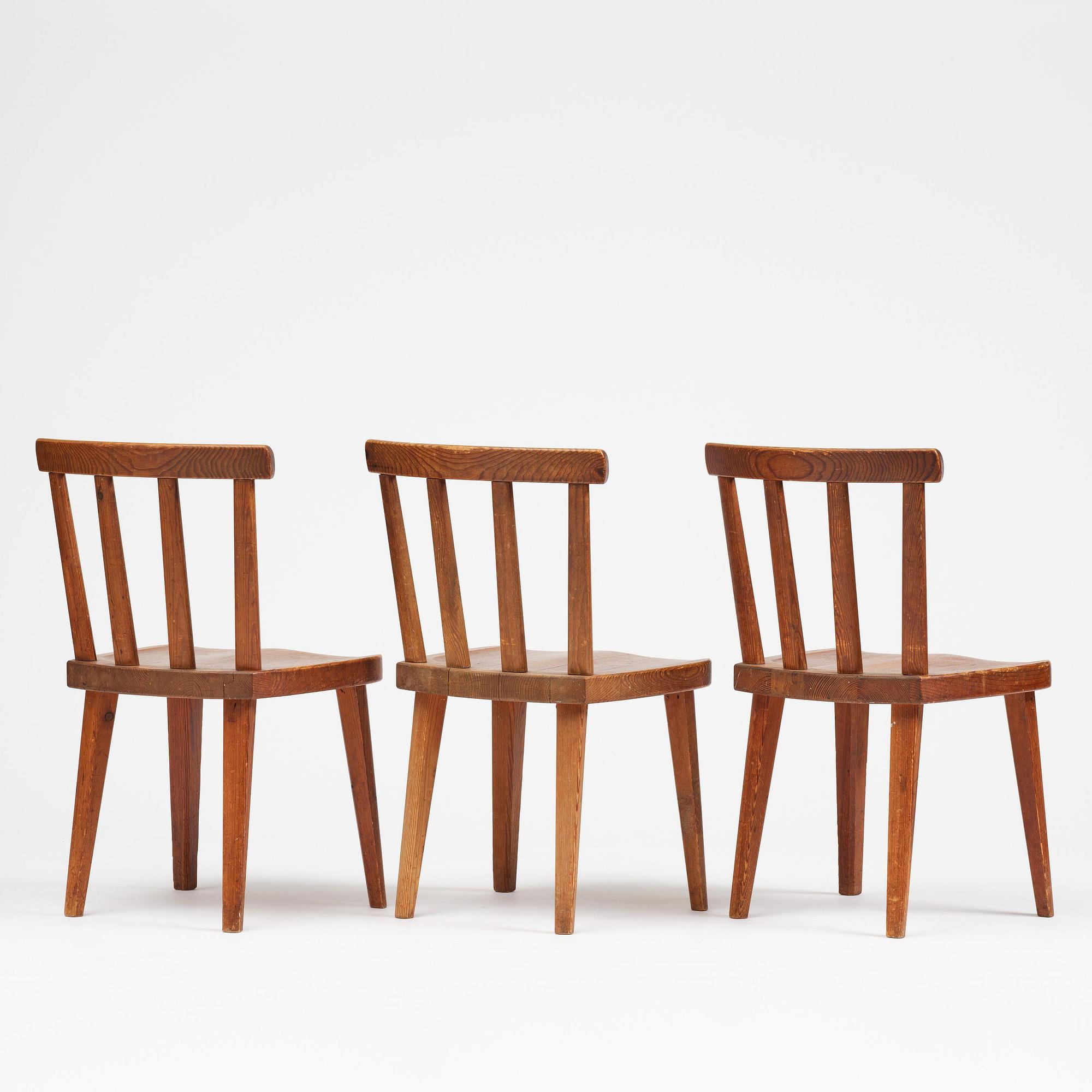 Axel Einar Hjorth, a set of three stained pine "Utö" chairs, Nordiska Kompaniet, Sweden, 1930s.