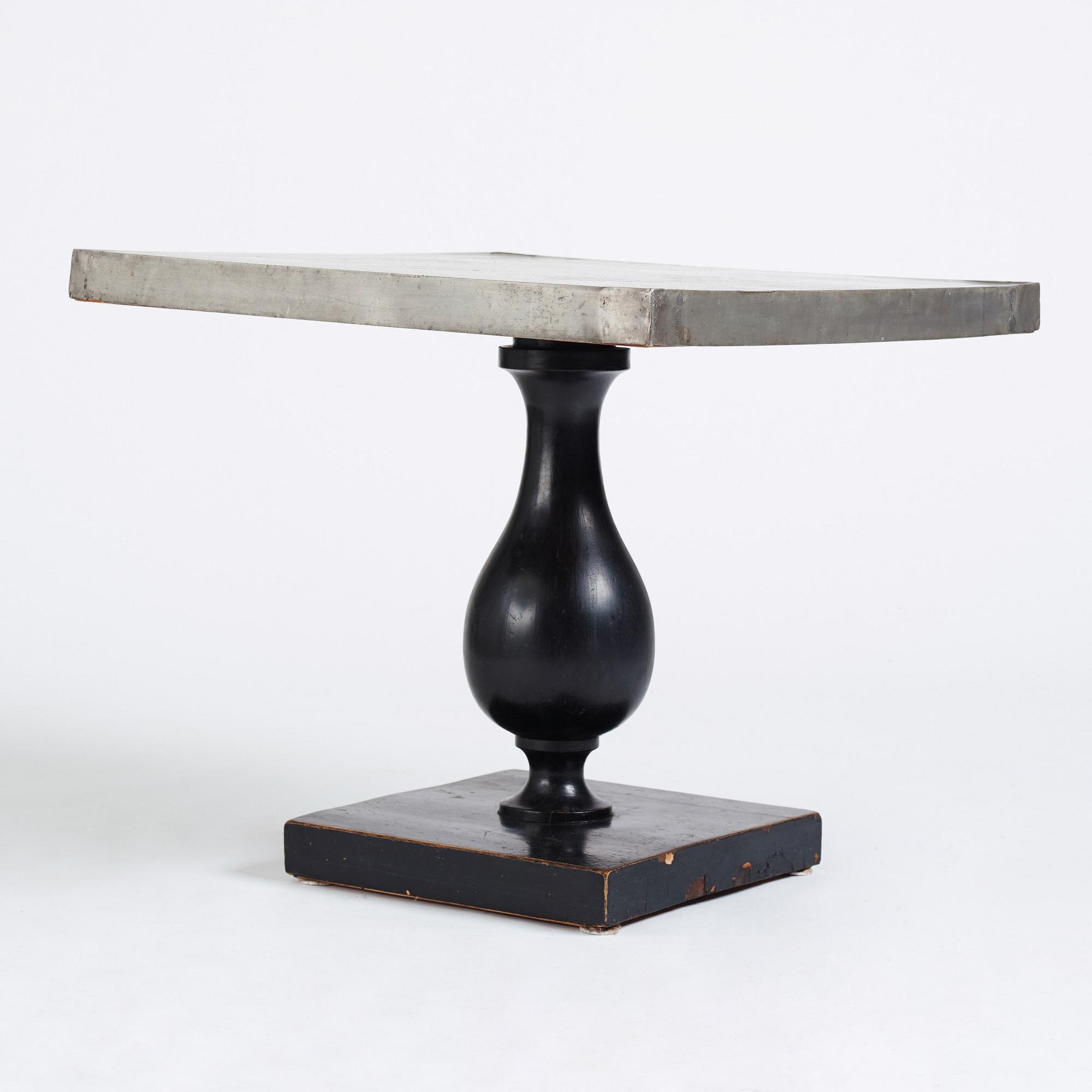 Uno Åhrén, a black lacquered table with a pewter top by Nils Fougstedt, Svenskt Tenn ca 1930. Alva & Gunnar Myrdal Collection.