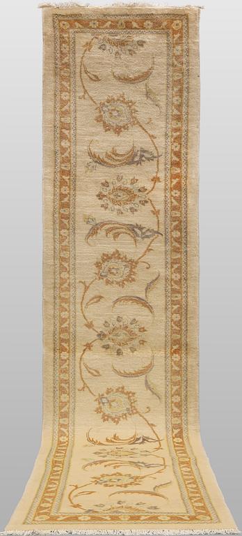 A runner carpet, Tabriz, 398 x 81 cm.
