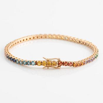 Bracelet 18K gold with faceted emeralds and sapphires in various colors.