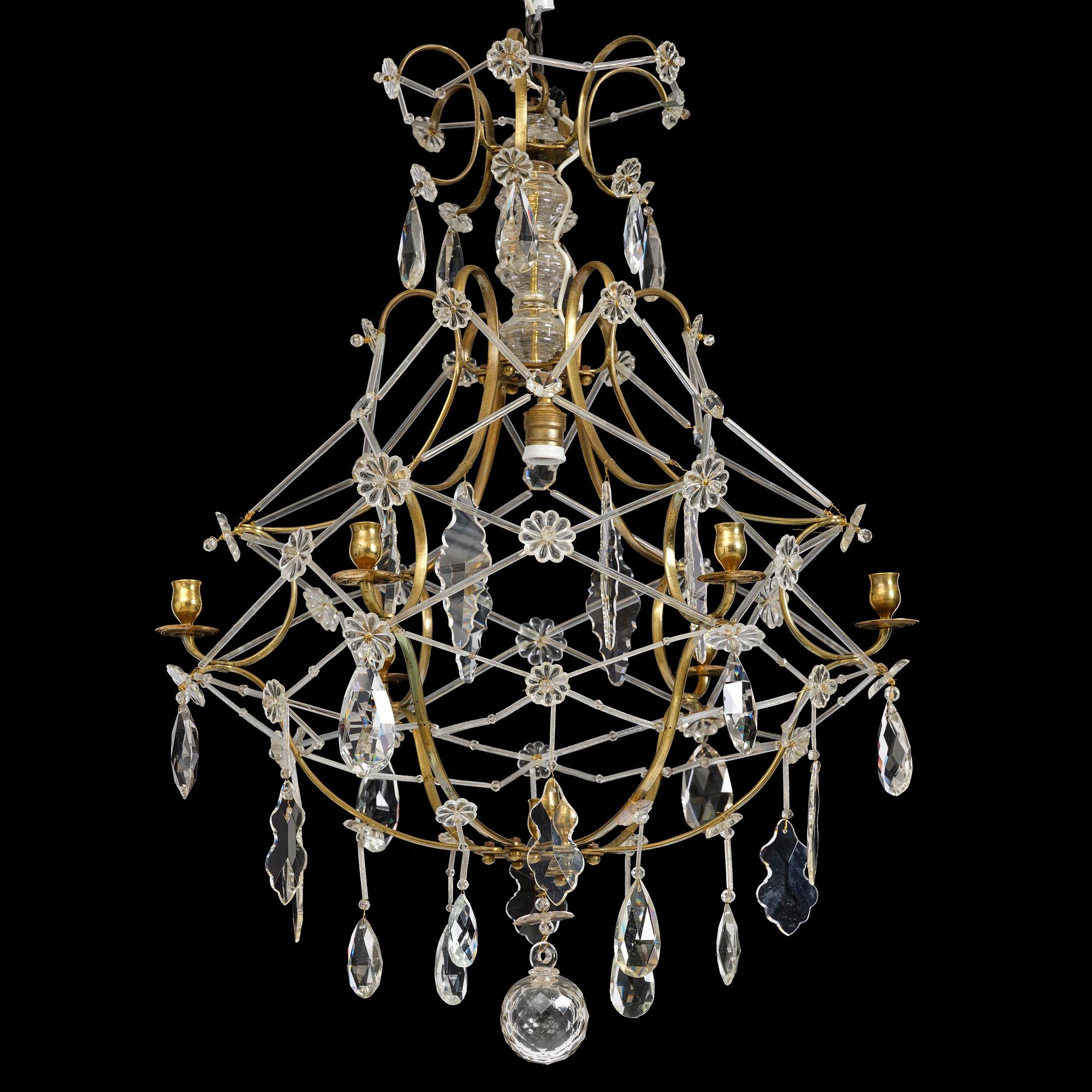 A seven-light gilt brass and cut glass rococo chandelier, mid 18th century.