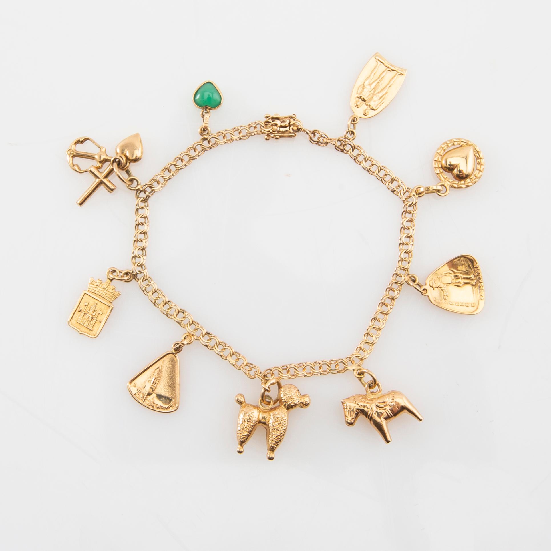 Armband Bismarck-länk 18K guld med berlocker.