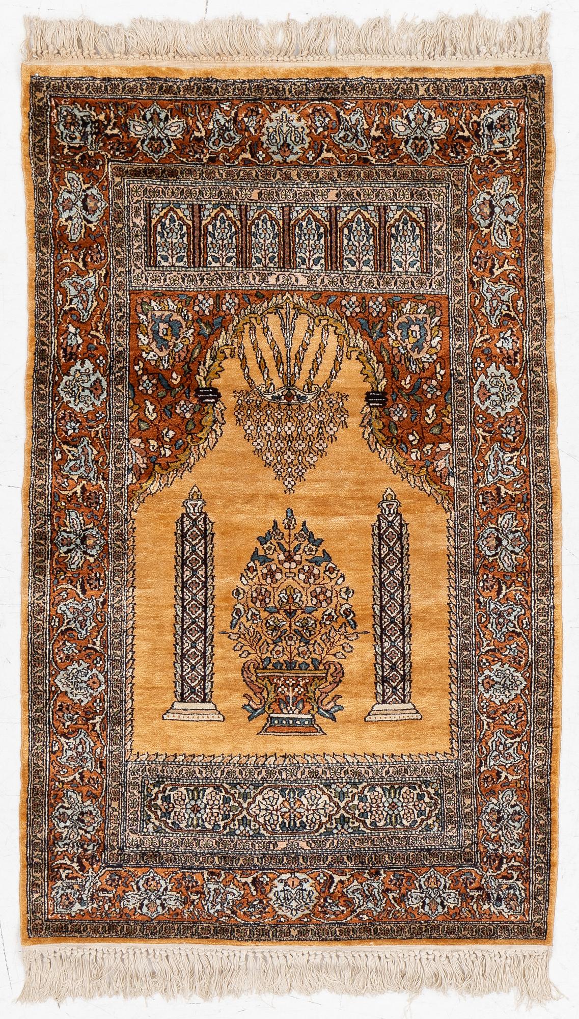 A silk Quum rug, c. 125 x 75 cm.