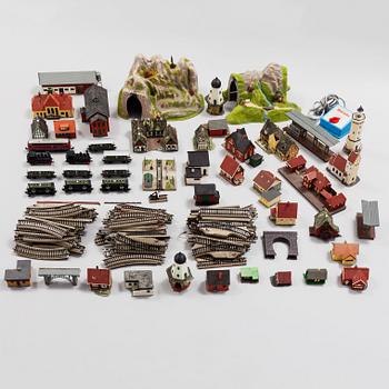 A model train set with locomotives, wagons, rail H0, Danish village houses, tunnel, mountain and more.