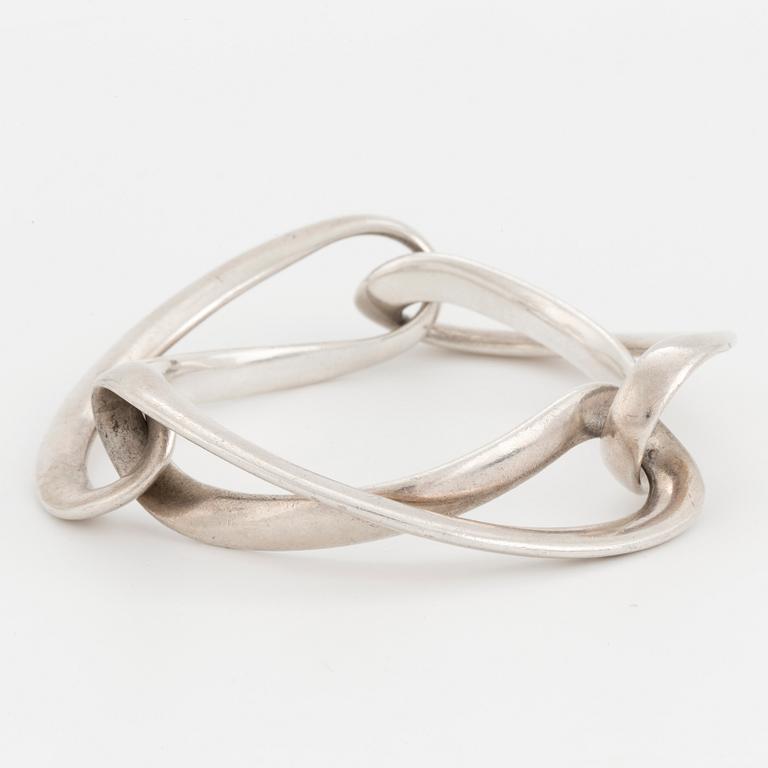 An 'Infinity' silver bracelet by Georg Jensen.
