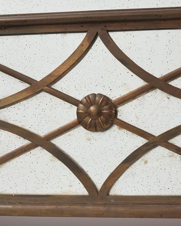 Swedish Grace, a brass framed wall mirror, 1920-30s.