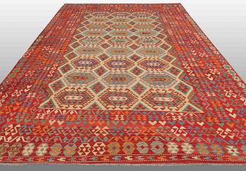 An oriental kilim, around 510 x 305 cm.