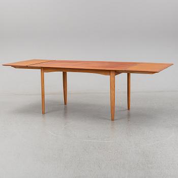 A 1950/60's dining table from Slagelse Møbelvaerk A/S with two additional leaves.