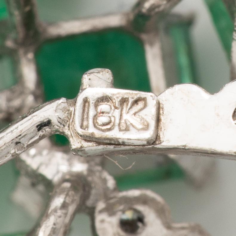 Brooch, 18K white gold with emeralds and octagonal-cut diamonds.