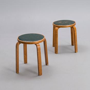 ALVAR AALTO, A PAIR OF STOOLS.