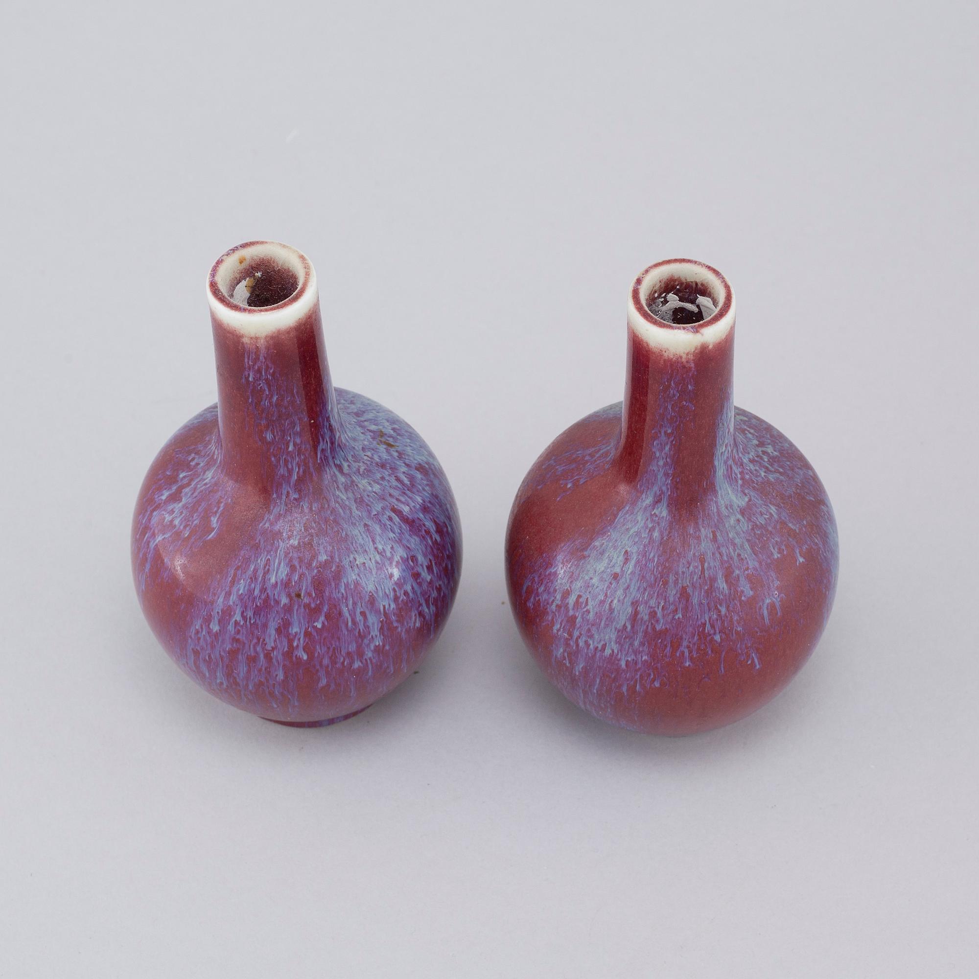 A pair of sang de boeuf vases, 20th cenutry.
