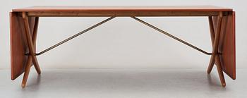 A Hans J Wegner teak and oak sabre leg dinner table by Andreas Tuck, Denmark 1950-60's.