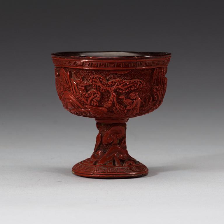 A carved cinnabar lacquer stem cup, Qing dynasty, 17th/18th Century.