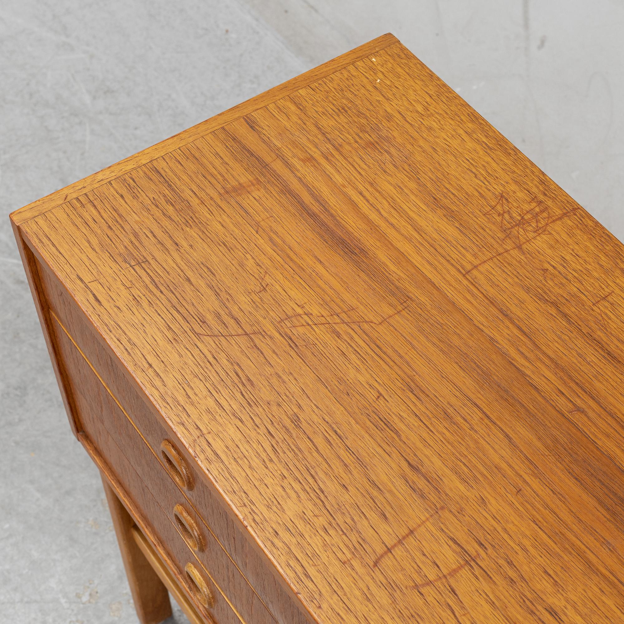 A 1950's/60's teak veneered chest of drawers.