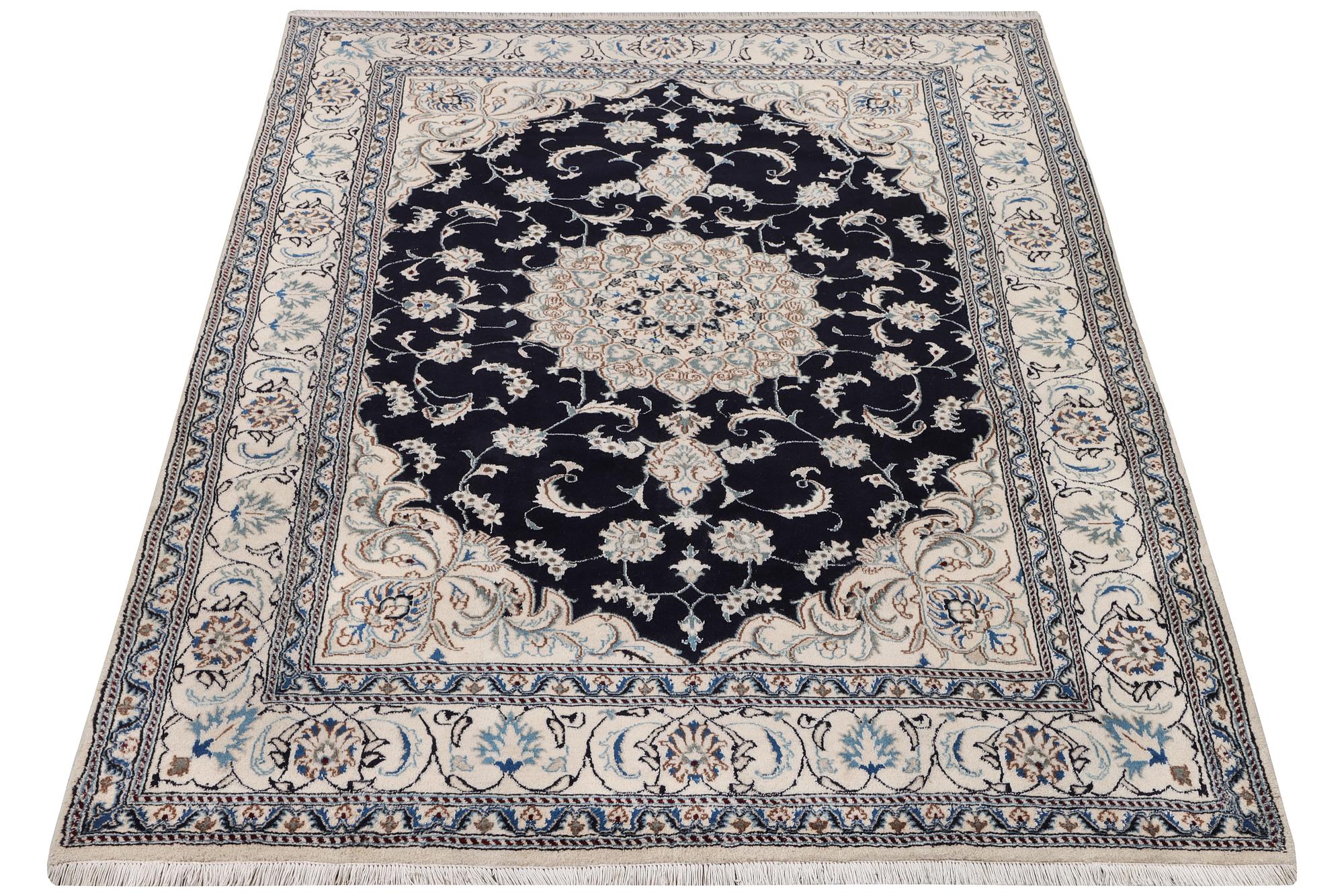 A Nain carpet, part silk, c. 303 x 200 cm.
