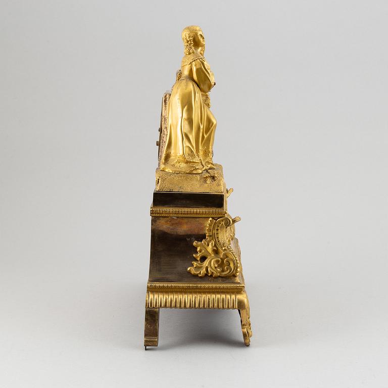 A rococo style brass mantle clock, second half of the 19th Century.