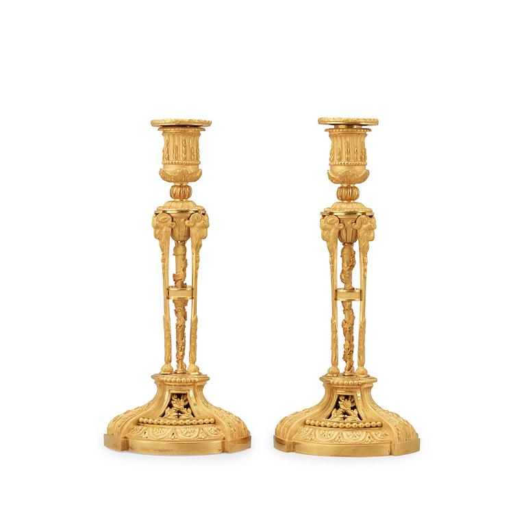 A pair of Louis XVI-style candlesticks, presumably early 20th century.