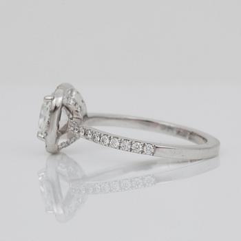 A 1.04 ct cushion-cut diamond ring surrounded by pavé-set brilliant-cut diamonds. Quality D/IF according to certificate.