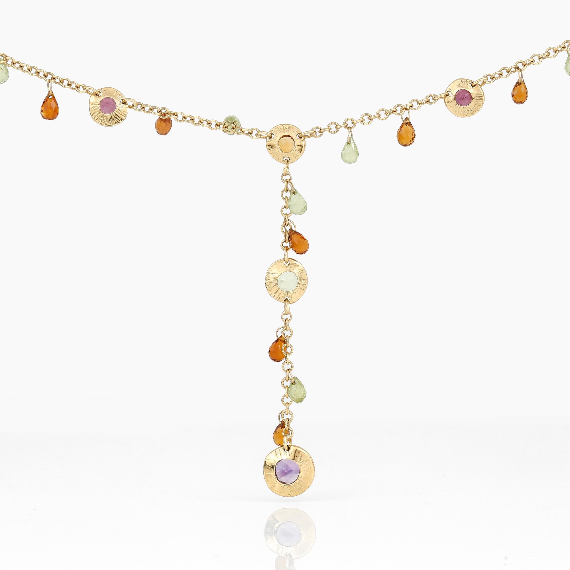 An 18K gold necklace with amethysts, peridotes and citrines.