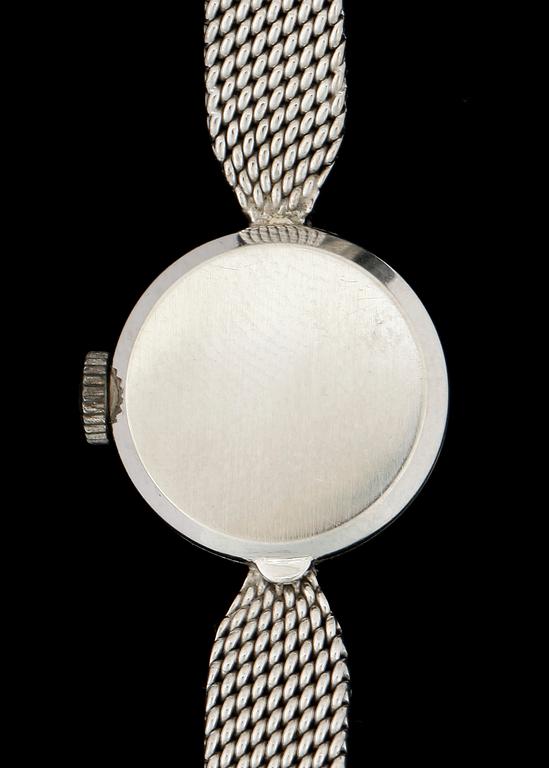 DAMARMBANDSUR, vitguld 18k, två små briljantslipade diamanter, Movado. Vikt ca 22 gram.