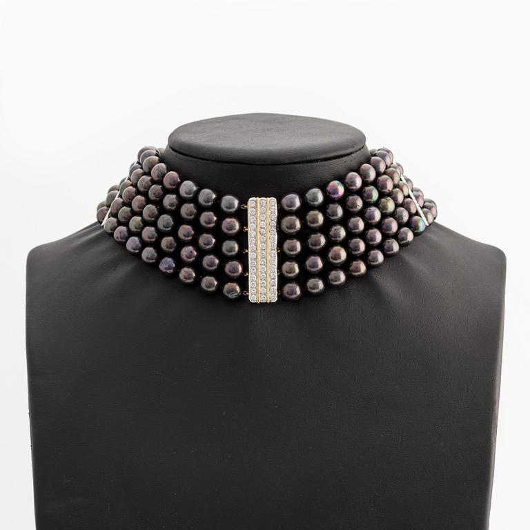Bracelet and necklace, cultured black pearls, gold and white gold with brilliant-cut diamonds.