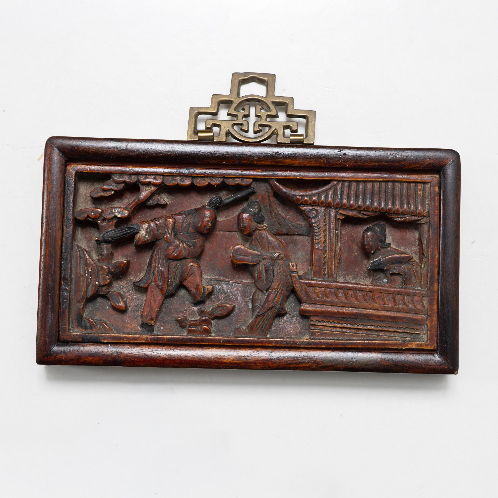 Three Chinese lacquer and wooden panels, two silk embroideries, first half of the 20th century.