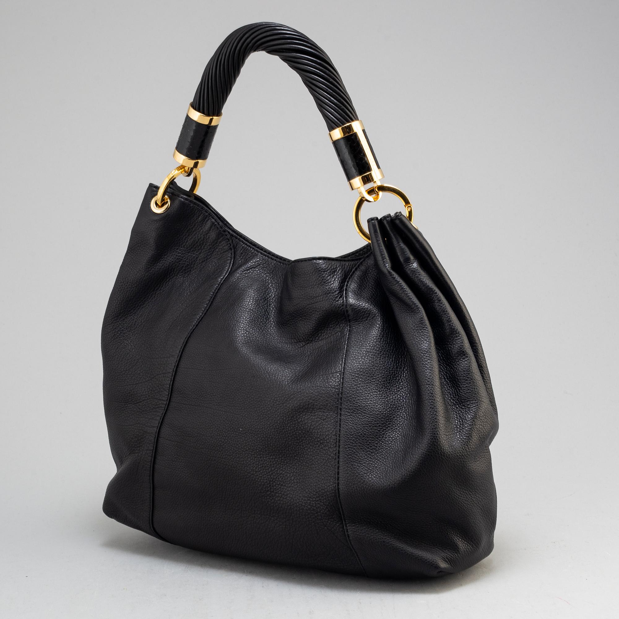 MICHAEL KORS, a black leather handbag.
