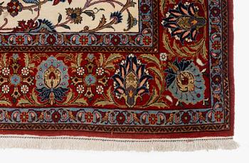A fine semi-antique Qum carpet, c. 352 x 222 cm.