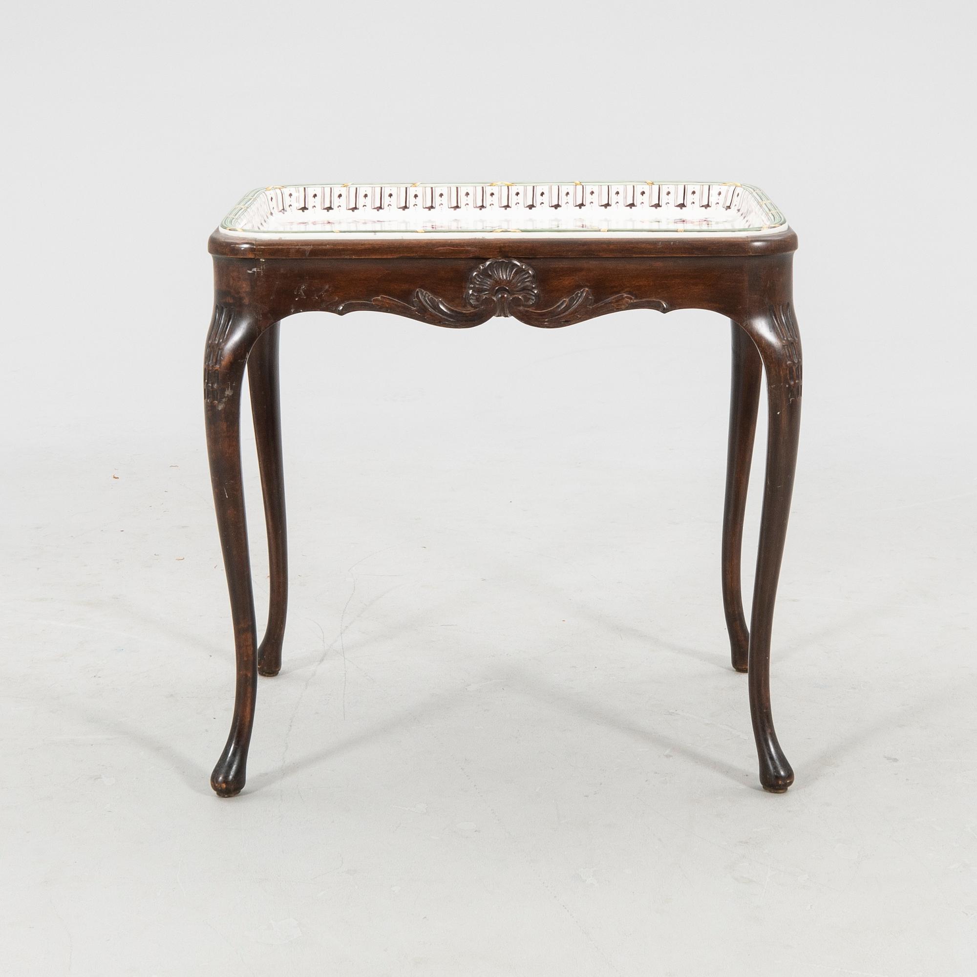 Rococo-style tea table signed and dated Rörstrand 1918 porcelain.