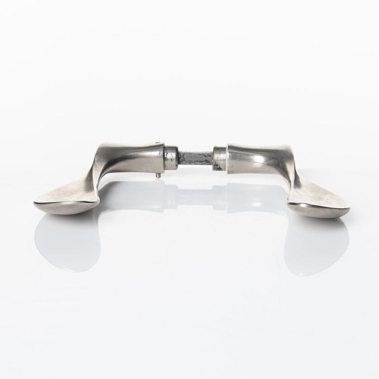 Arne Jacobsen, a door handle 'AJ-Grebet' for SAS Royal Hotel, Copenhagen 1956, executed by Carl F Petersen.
