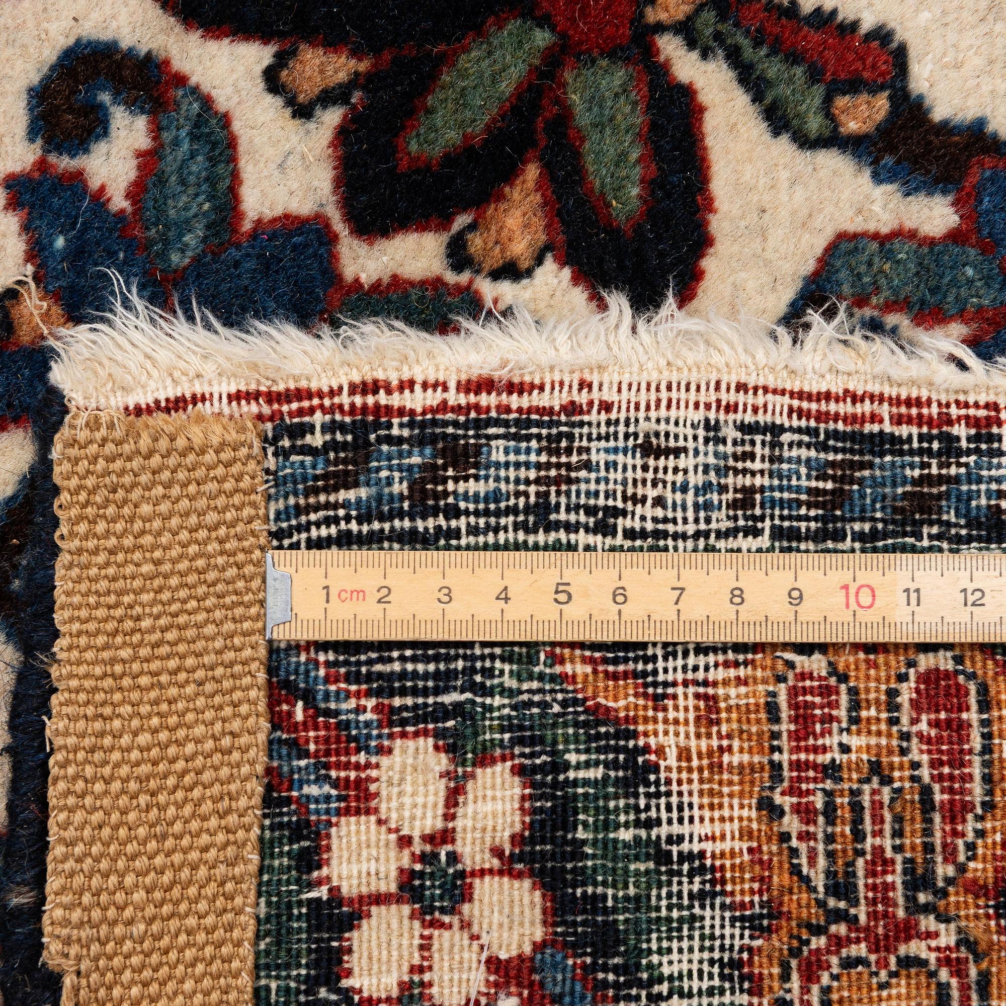 An antique Veramin carpet, West Persia, 380 x 271 cm.
