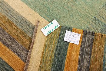 An Afghan kelim rug, c. 238 x 160 cm.
