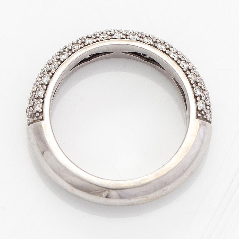 A 14K white gold ring with diamonds.