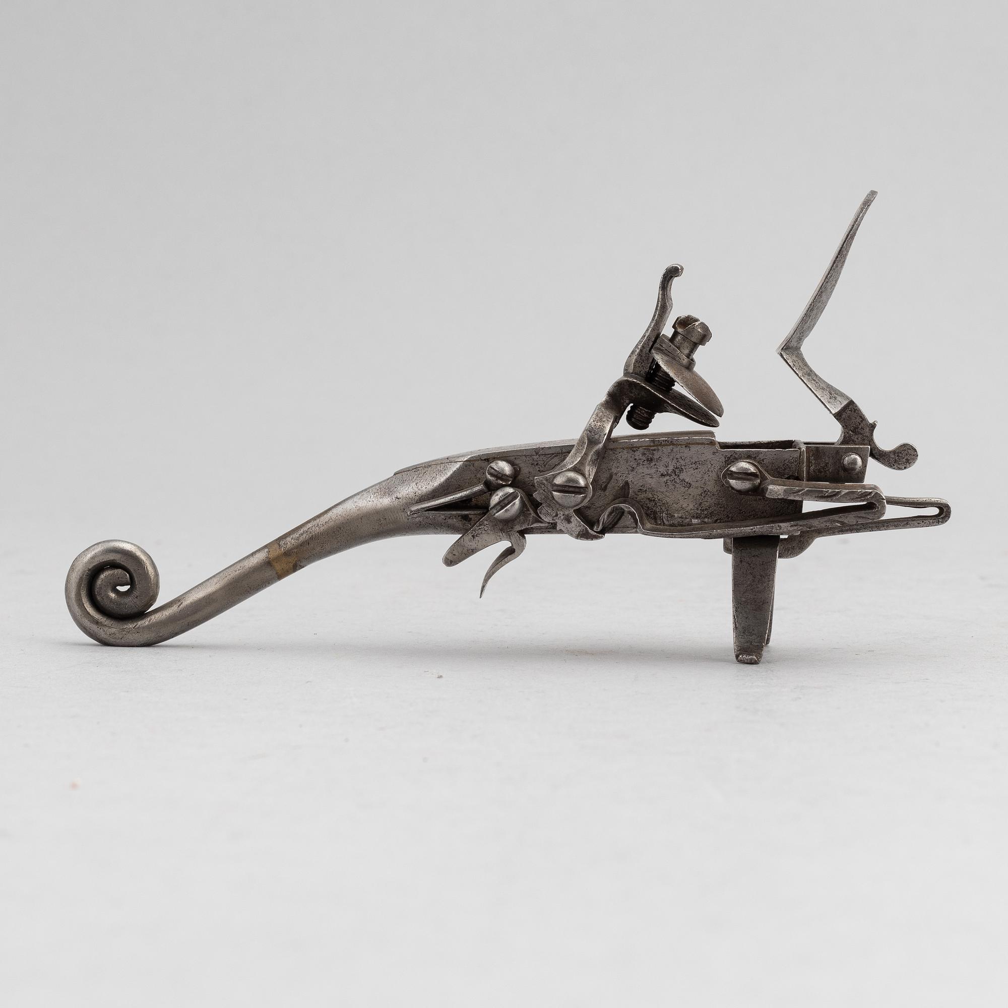 An 18th Century flintlock tinder lighter.