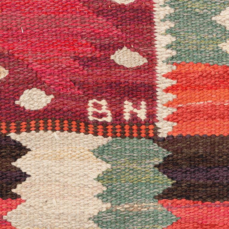 Barbro Nilsson, a carpet, 'Nejlikan röd', tapestry weave, c 331 x 214 cm, signed AB MMF BN.