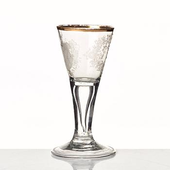 An engraved and gilded armorial wine glass, 18th Century.