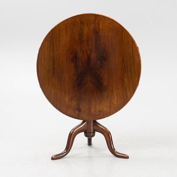 A tilt-top table.