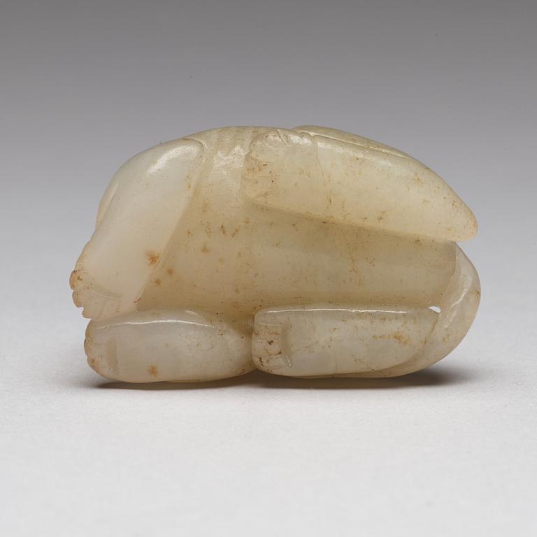 A Chinese nephrite snuff bottle, pendant and figurine.