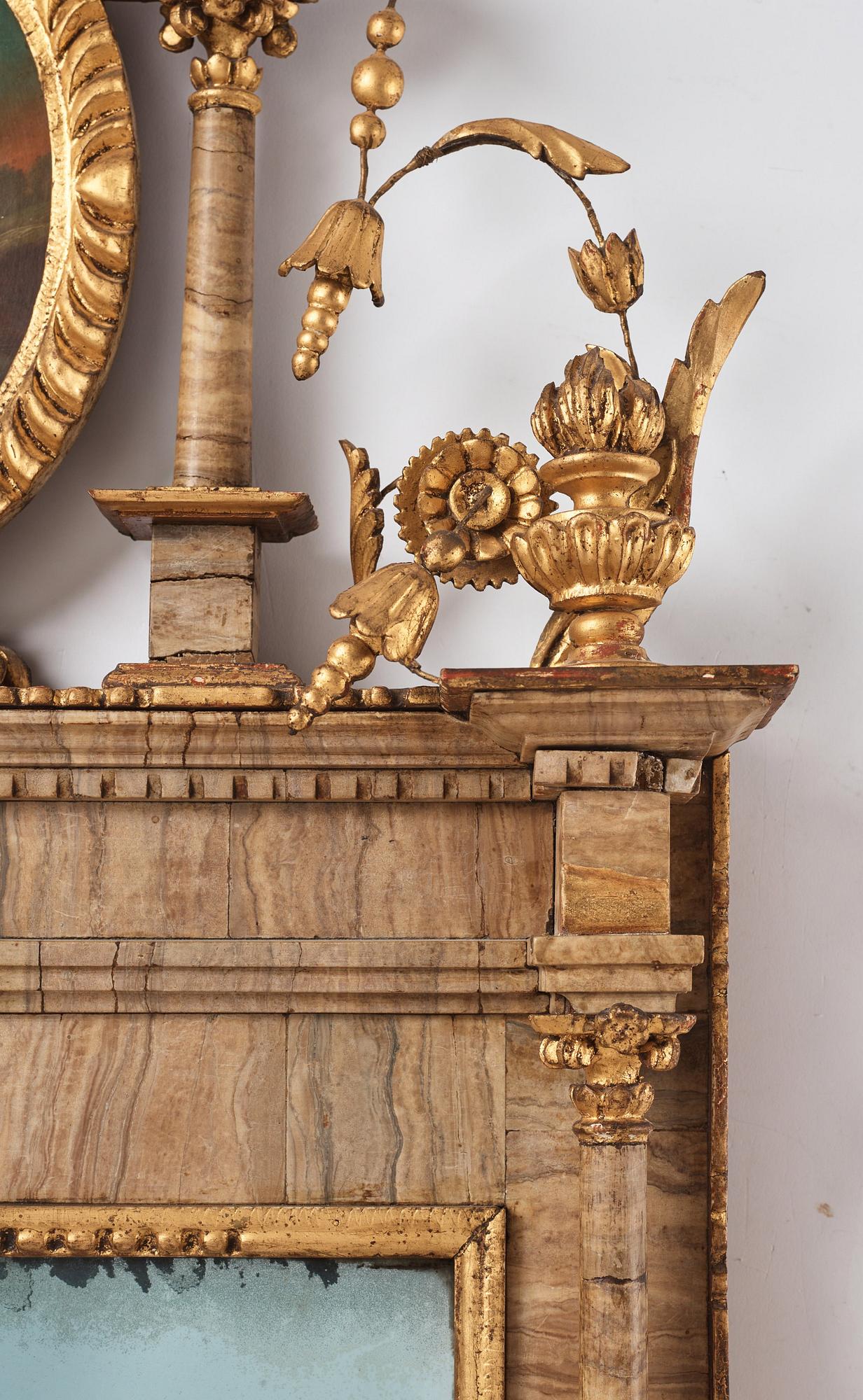 A pair of North-Italian Louis-XVI marble-mounted and carved giltwood mirrors, circa 1800.