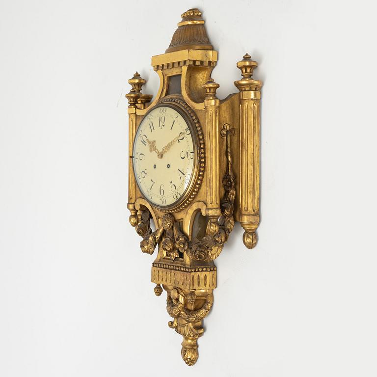 A Gustavian style wall clock, 20th century.