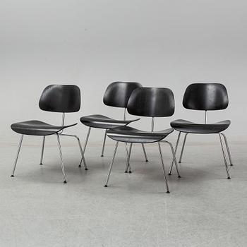 Four 'DCM' Plywood Group chairs by Charles and Ray Eames for Vitra.