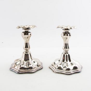 Candelabras a pair and candlesticks a pair Rococo style silver plate 20th century.