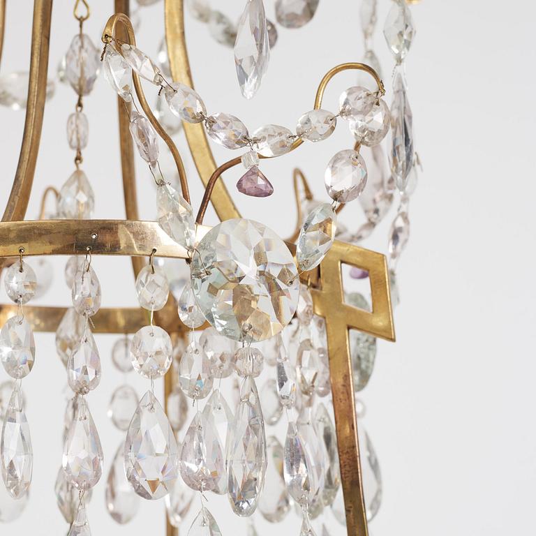 A German Louis XVI ormolu and cut-glass nine-light chandelier attributed to Johann Christoph Ermisch, late 18th century.