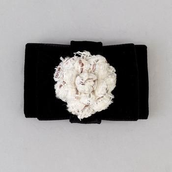 A Brooch by CHANEL.