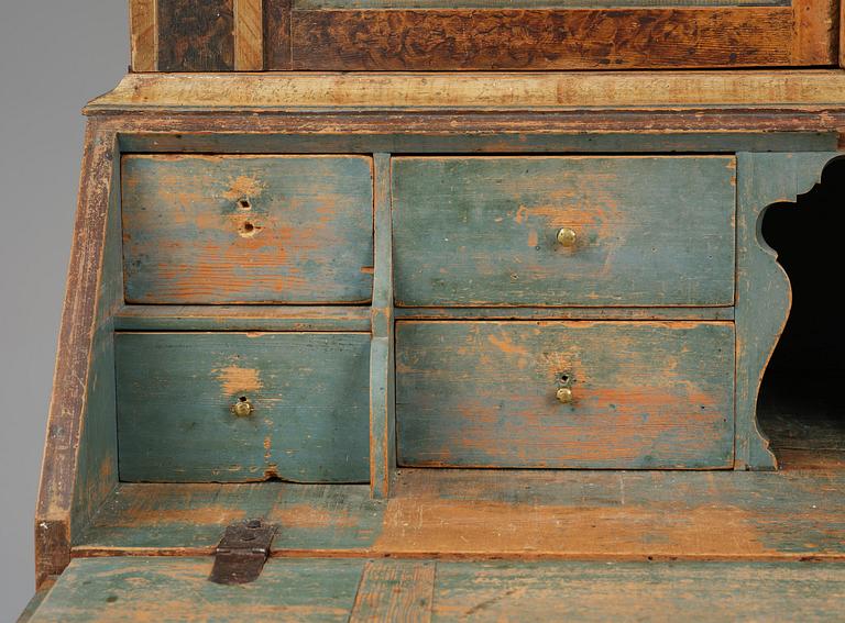 A polychrome-painted folk art cabinet from Värmland, Sweden, dated 1818.
