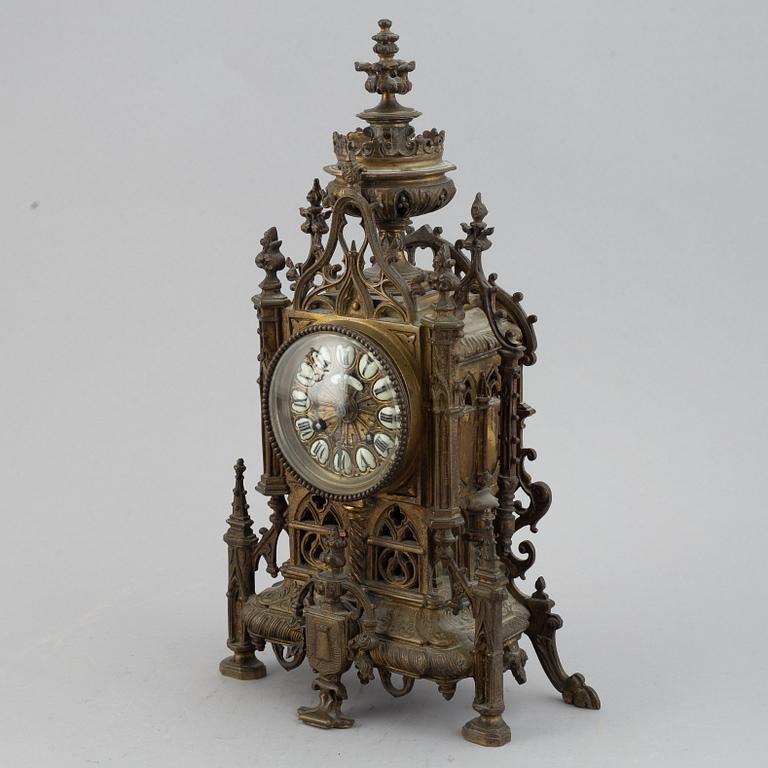 A mantle clock with pair of candelabra, late 19th century.