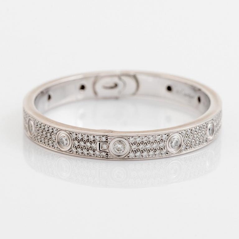 A Cartier "Love" bracelet in 18K white gold set with round brilliant-cut diamonds.