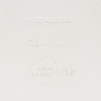 A 'Plastic chair DSW' by Charles and Ray Eames for Vitra.